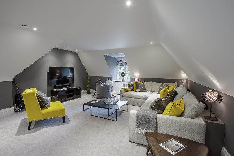 Photo of a contemporary enclosed family room in Hampshire with a game room, grey walls, carpet, a wall-mounted tv and grey floor.