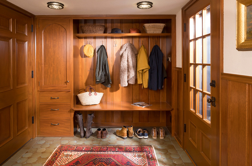 Photo of a traditional mudroom in Minneapolis with white walls, a single front door and a glass front door.