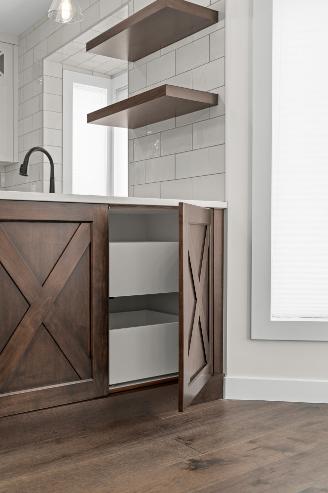 Example of a transitional home design design in Calgary