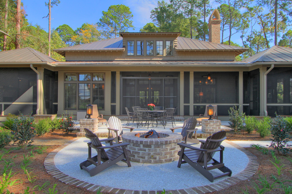 This is an example of a traditional backyard patio in Atlanta with a fire feature.