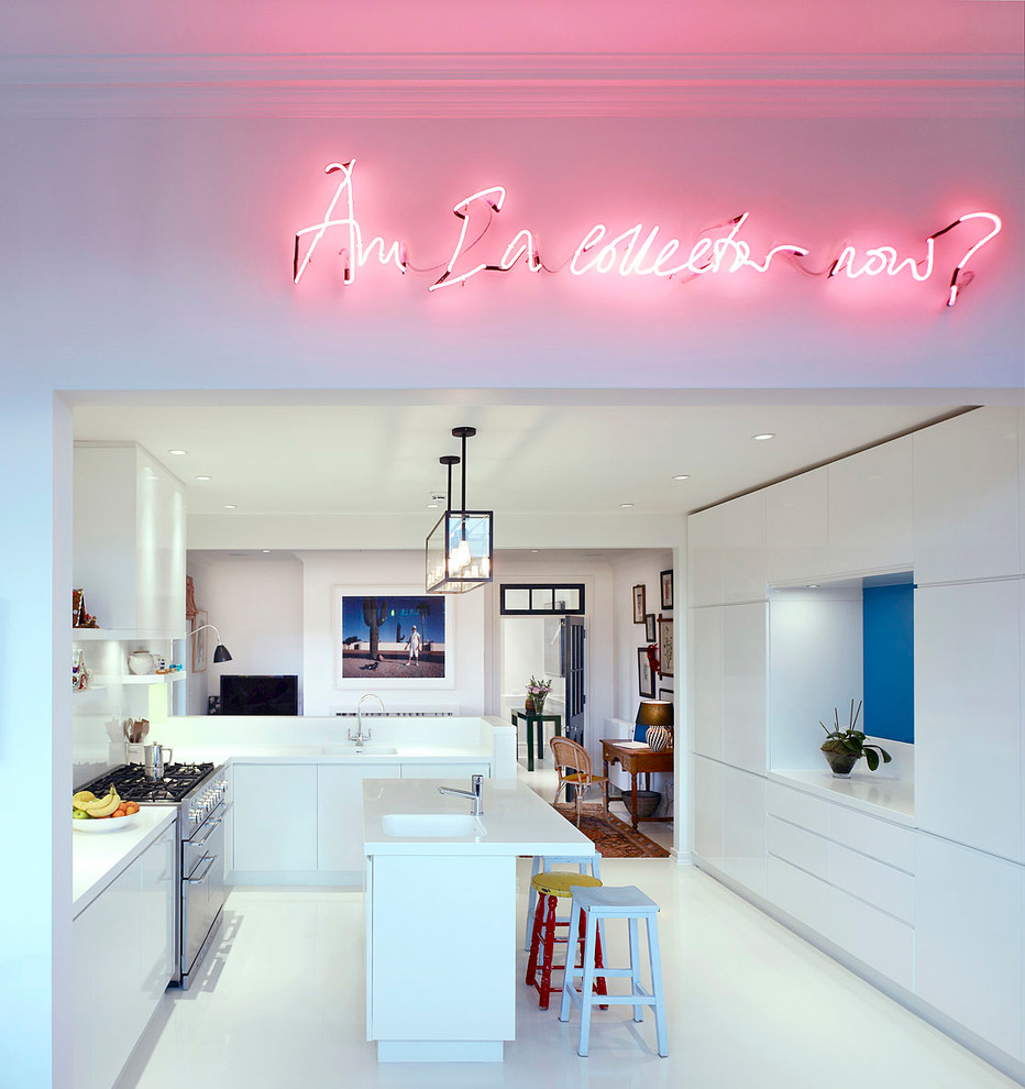 Design ideas for a contemporary u-shaped kitchen in London with a single-bowl sink, flat-panel cabinets, white cabinets and an island.