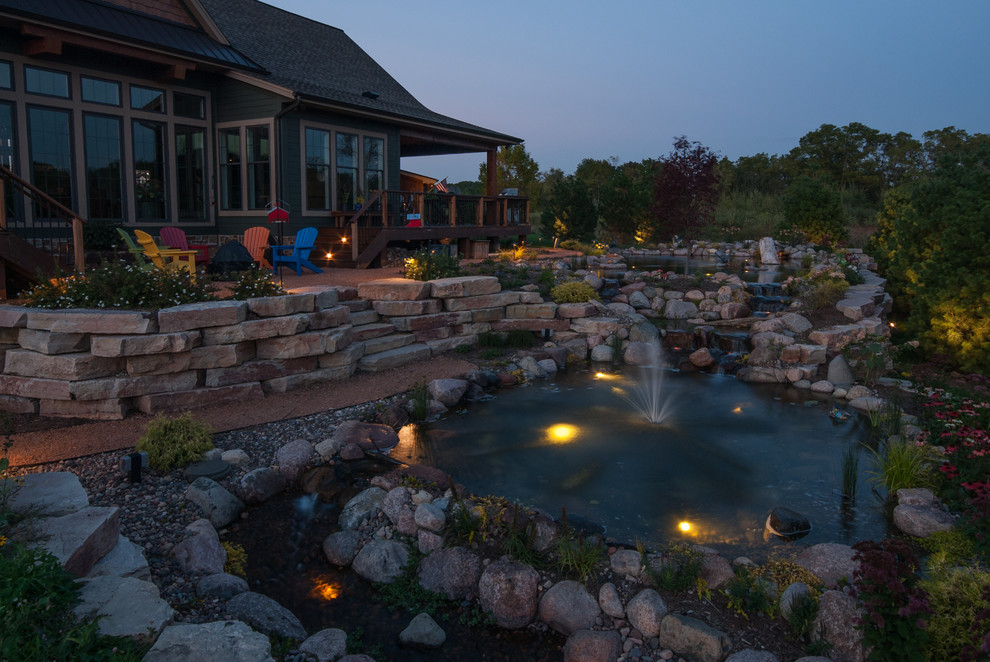 Example of a mountain style home design design in Milwaukee