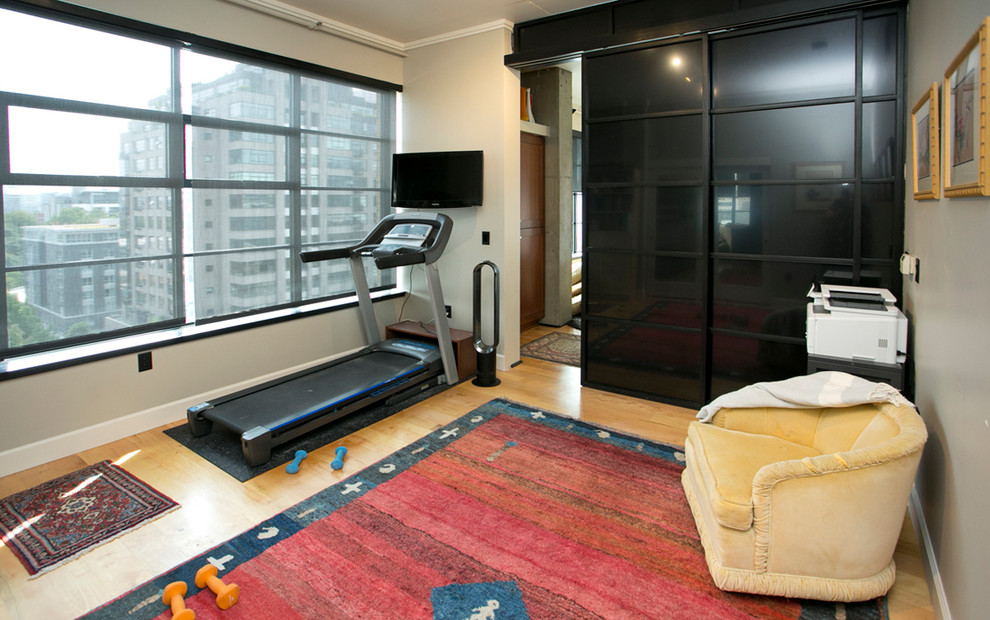 Mid-sized contemporary multipurpose gym in Portland with grey walls, light hardwood floors and brown floor.
