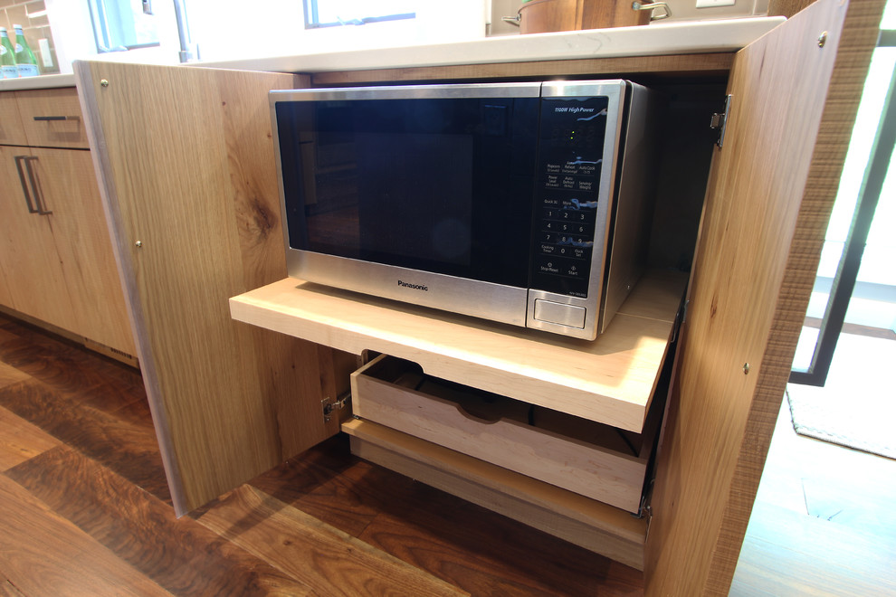 Inspiration for a large transitional l-shaped medium tone wood floor and brown floor open concept kitchen remodel with an undermount sink, flat-panel cabinets, medium tone wood cabinets, quartz countertops, gray backsplash, porcelain backsplash, stainless steel appliances and an island