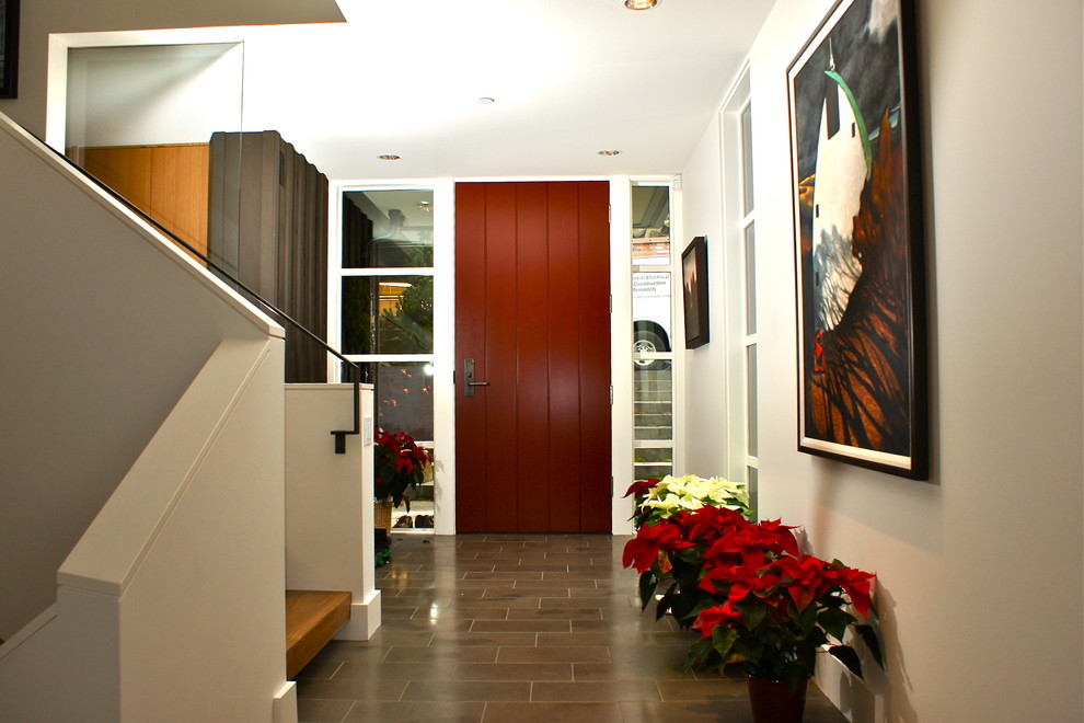 Contemporary foyer in Seattle with a single front door, a red front door, ceramic floors and grey floor.