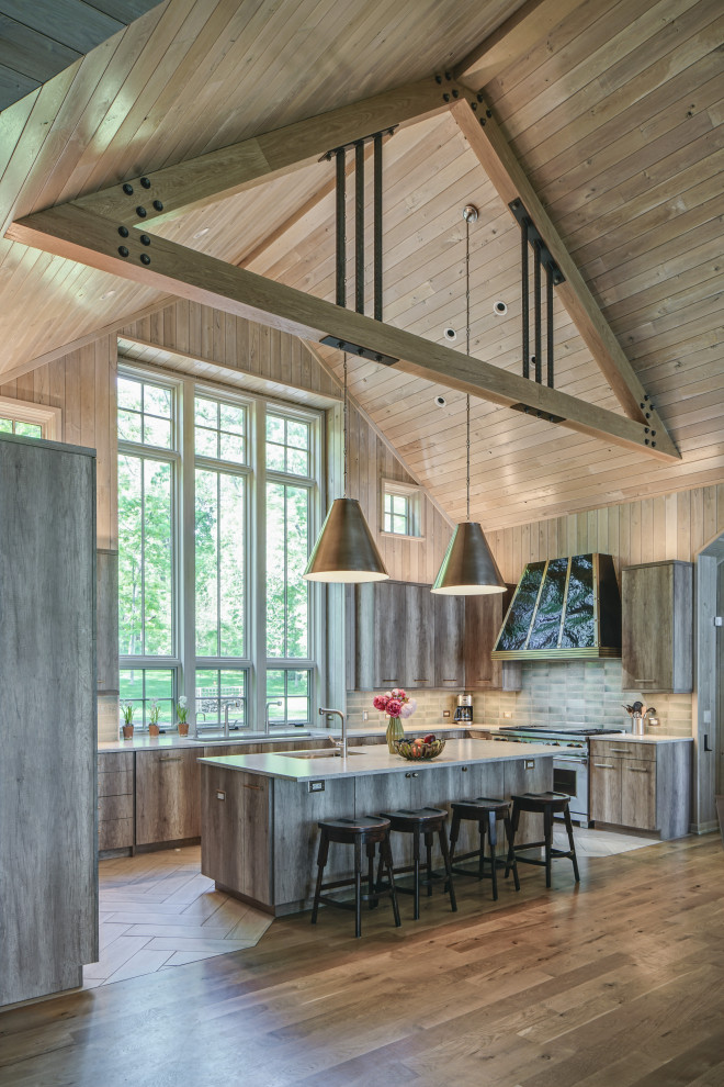 Photo of a rustic u-shaped kitchen in Chicago with a submerged sink, flat-panel cabinets, light wood cabinets, grey splashback, stainless steel appliances, an island, beige floors, white worktops, a vaulted ceiling and a wood ceiling.