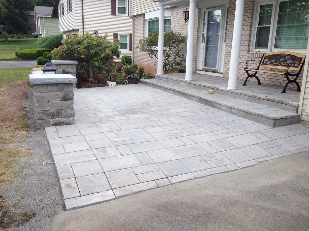 Photo of a small traditional front yard patio in Bridgeport with natural stone pavers and no cover.