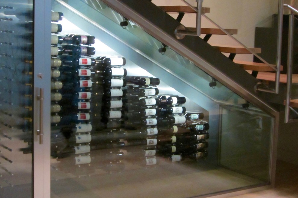 Design ideas for a small contemporary wine cellar in Dallas with bamboo floors and storage racks.