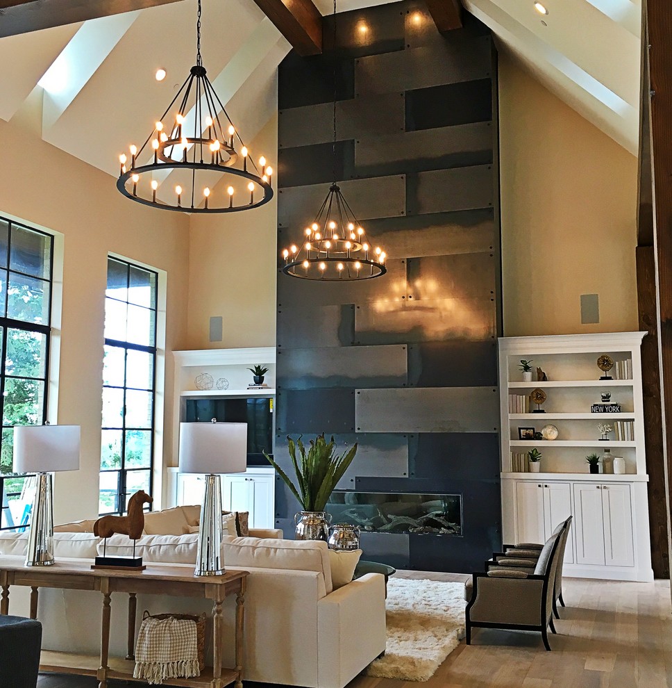 This is an example of an expansive contemporary open concept living room in Portland.