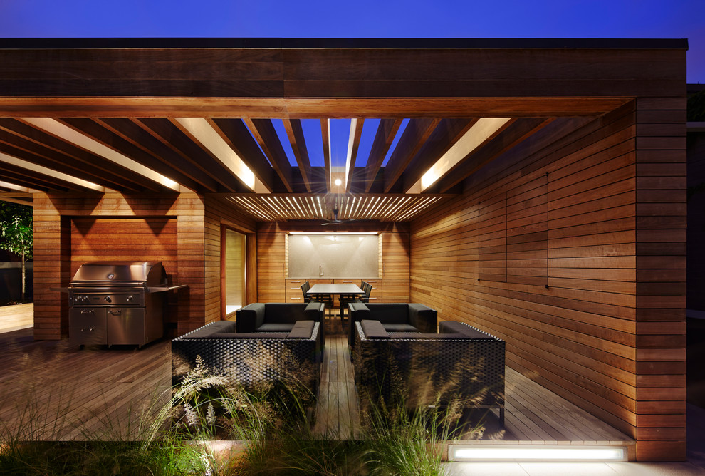 Inspiration for a contemporary rooftop deck in Chicago with an outdoor kitchen and a pergola.