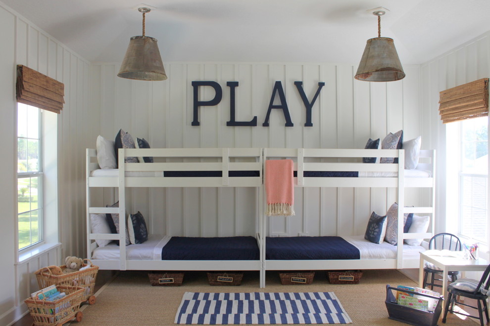 Design ideas for a large beach style gender-neutral kids' bedroom for kids 4-10 years old in Jacksonville with white walls.