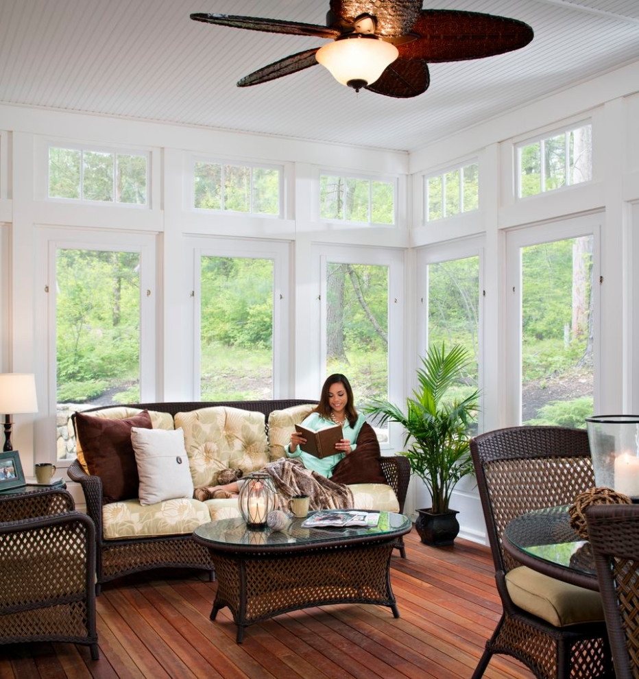 Photo of a large eclectic sunroom in Boston with dark hardwood floors.