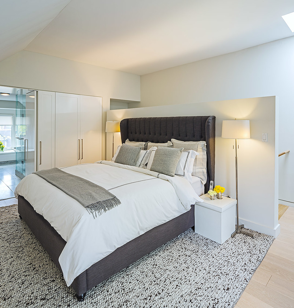 This is an example of a contemporary bedroom in Toronto.