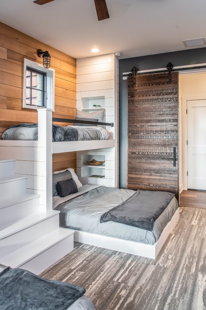 Organic Modern Mountain Home - A rustic kids' room designed for ages 4 to 10, featuring cozy double deck beds, soft gray carpet flooring, and a warm, playful ambiance. This functional and eco-friendly space is part of the sustainable organic modern mountain home