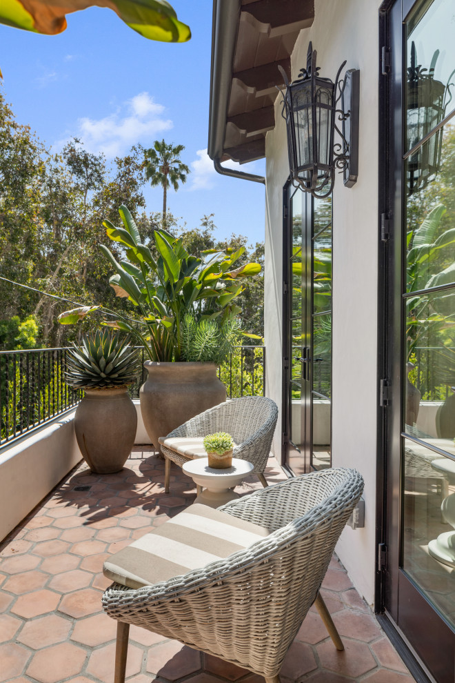 Mid-sized mediterranean balcony in Los Angeles with metal railing.