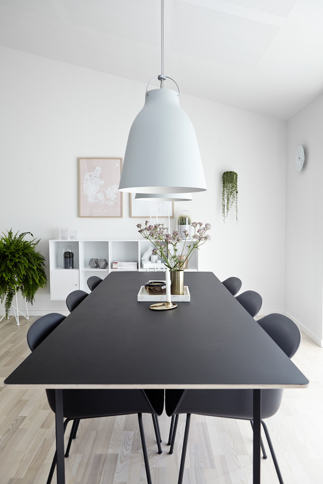 Design ideas for a scandinavian dining room in Wiltshire.