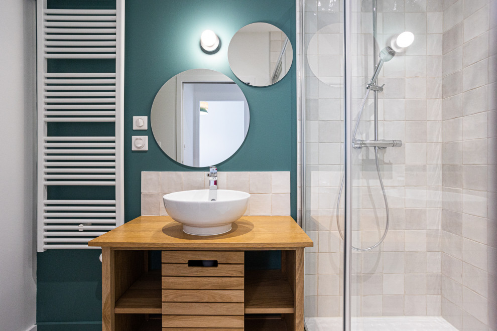 Design ideas for a medium sized scandinavian shower room bathroom in Bordeaux with beaded cabinets, light wood cabinets, a built-in shower, white tiles, terracotta tiles, blue walls, vinyl flooring, a vessel sink, wooden worktops, grey floors, a sliding door, a laundry area, a single sink and a built in vanity unit.