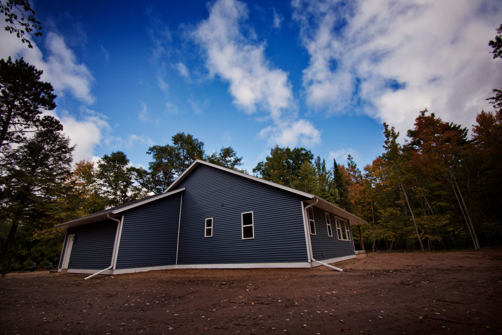 Inspiration for a mid-sized rustic blue one-story vinyl house exterior remodel with a shingle roof