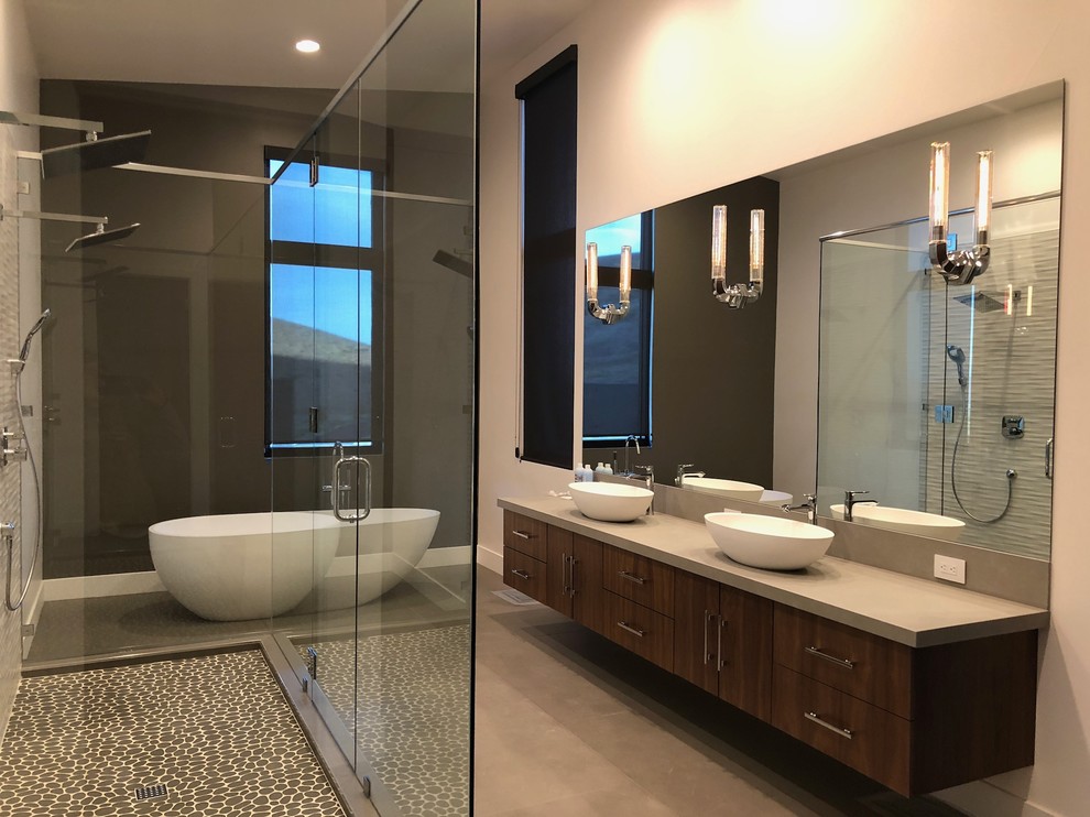 Photo of a large contemporary master bathroom in Sacramento with a freestanding tub.