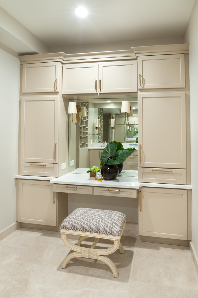 Inspiration for a large transitional master bathroom in Detroit with recessed-panel cabinets, beige cabinets, a corner shower, beige walls, porcelain floors, an undermount sink, beige floor, a hinged shower door and white benchtops.