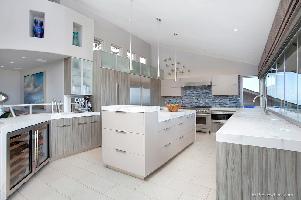 Inspiration for a large contemporary u-shaped open plan kitchen in San Diego with an undermount sink, flat-panel cabinets, grey cabinets, tile benchtops, blue splashback, glass tile splashback, stainless steel appliances, porcelain floors and with island.