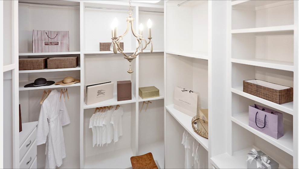Large gender-neutral walk-in wardrobe in Dallas with shaker cabinets, white cabinets and carpet.