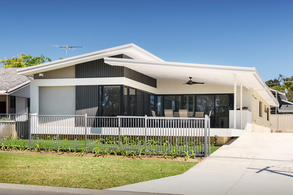 Design ideas for a contemporary one-storey white house exterior in Perth with a shed roof.