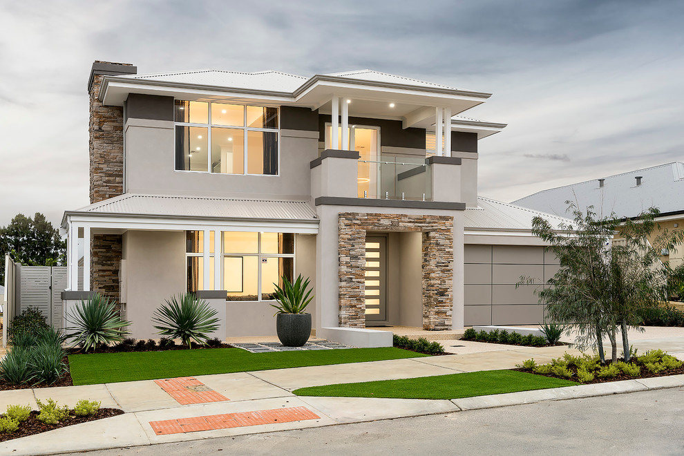 Inspiration for a large contemporary two-storey stucco grey exterior in Perth.
