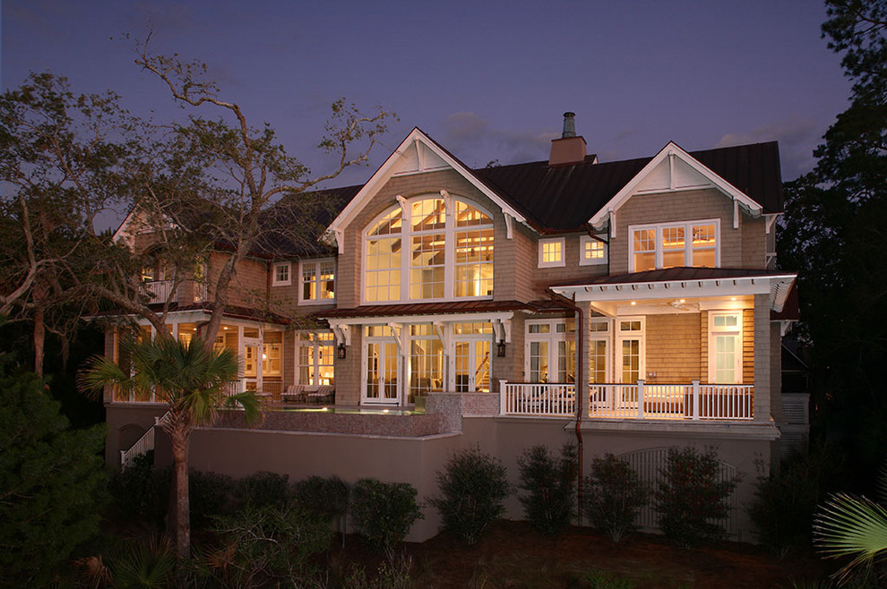 Design ideas for a traditional two-storey exterior in Charleston with wood siding.