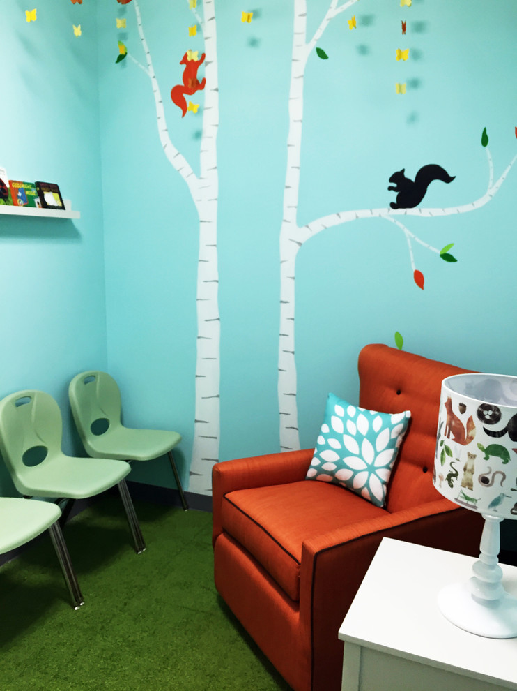 Inspiration for a small modern gender-neutral kids' room in New York with blue walls and carpet.