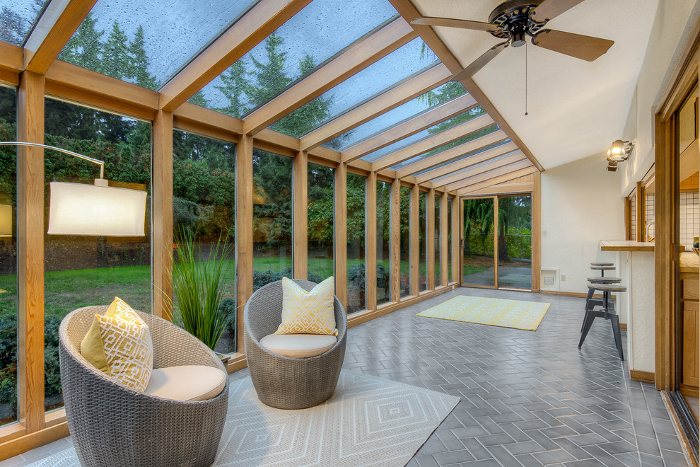 This is an example of a midcentury sunroom in Seattle.
