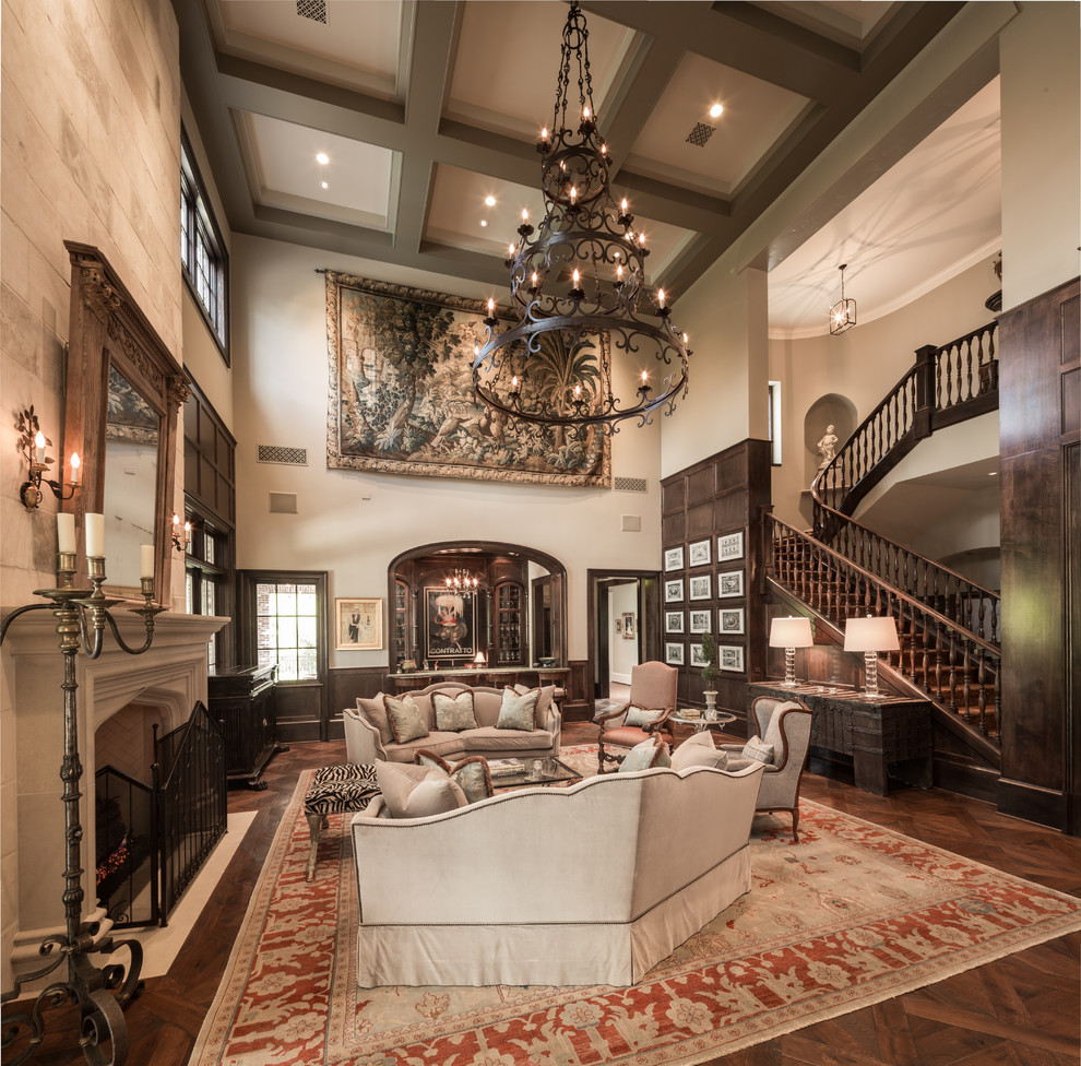 Inspiration for an expansive traditional formal open concept living room in Houston with beige walls, dark hardwood floors, a standard fireplace and no tv.