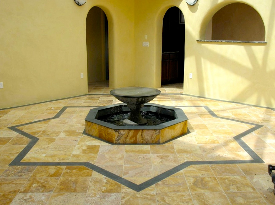 Inspiration for a mid-sized transitional travertine floor front door remodel in Albuquerque with yellow walls and a medium wood front door