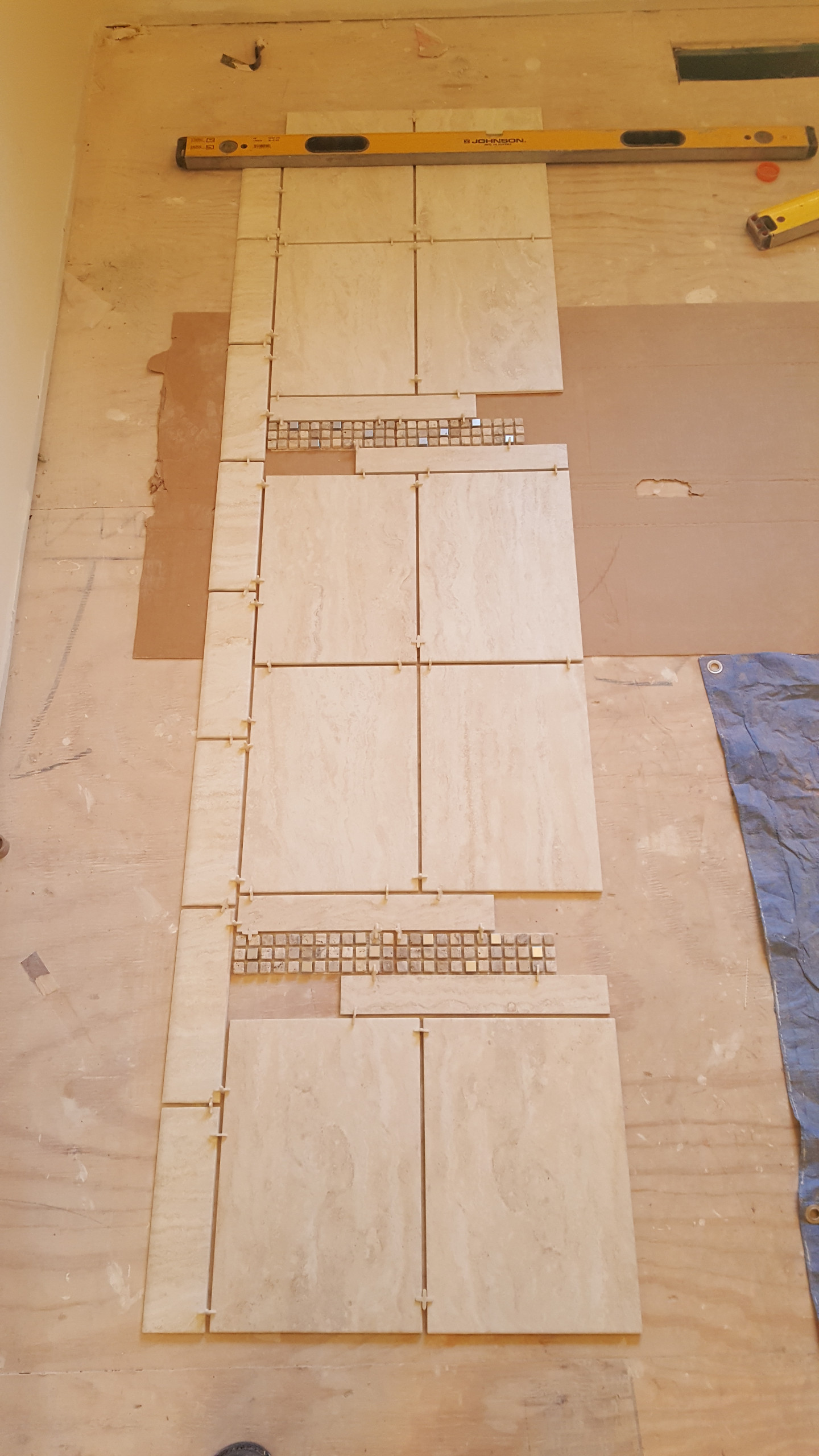 Designing the shower tile layout with custom accents