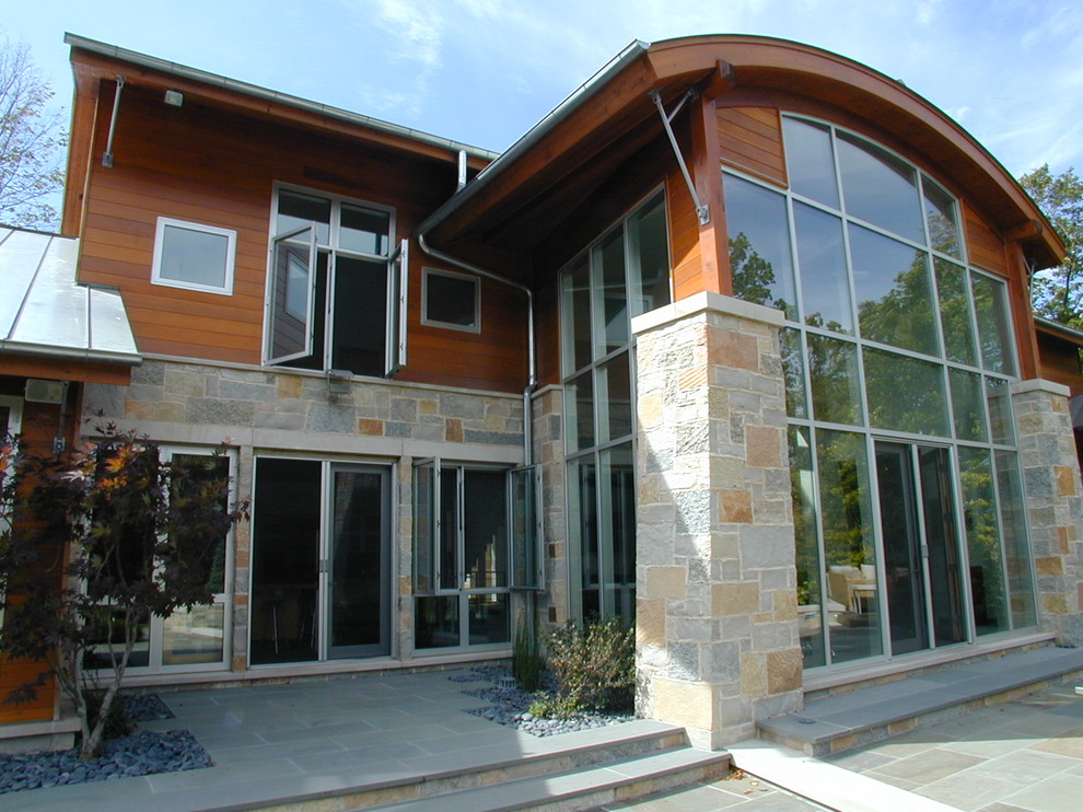 This is an example of a contemporary exterior in Milwaukee with stone veneer.
