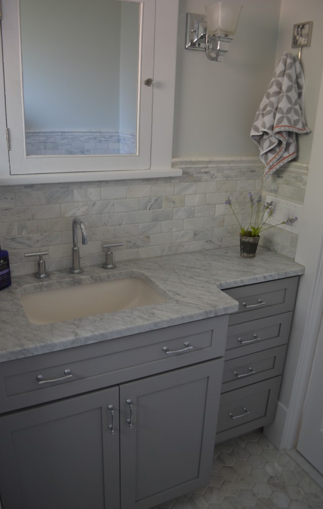 Inspiration for a mid-sized traditional master bathroom in New York with recessed-panel cabinets, grey cabinets, gray tile, multi-coloured tile, white tile, subway tile, white walls, ceramic floors, an undermount sink and marble benchtops.