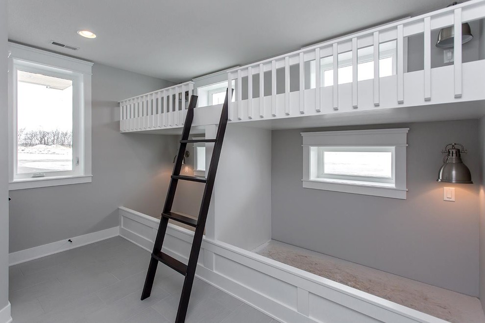 Mid-sized traditional kids' bedroom in Other with grey walls, porcelain floors and grey floor for kids 4-10 years old.