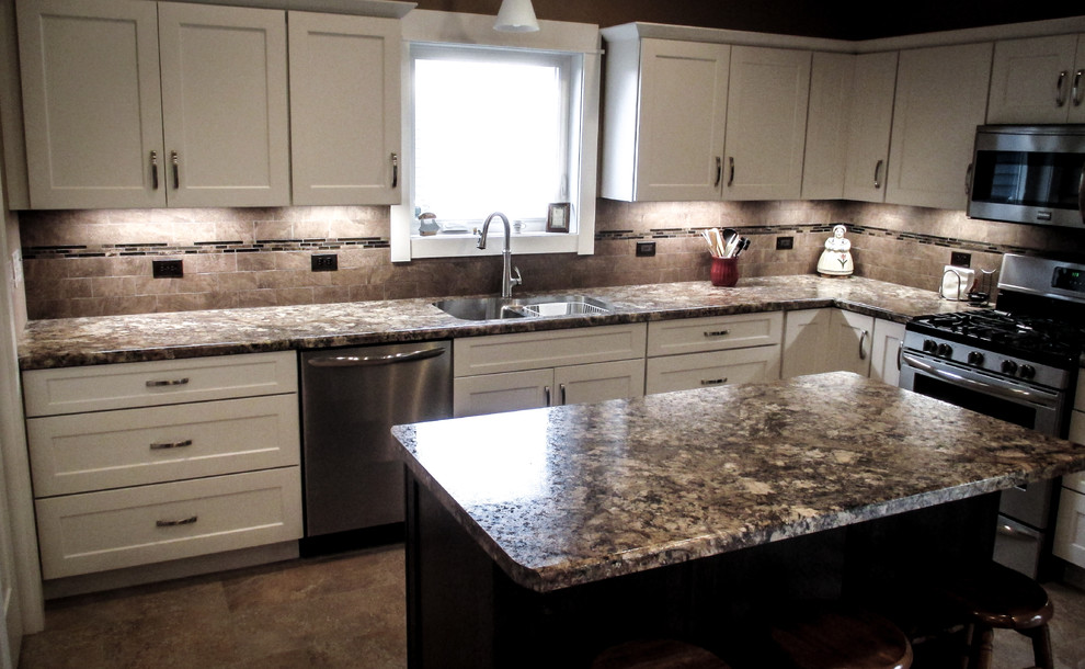 Inspiration for a transitional vinyl floor eat-in kitchen remodel with white cabinets, beige backsplash, stainless steel appliances and an island