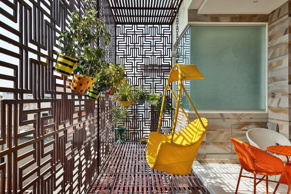 Photo of a Small contemporary terrace & balcony in Delhi With a Roof Extension.