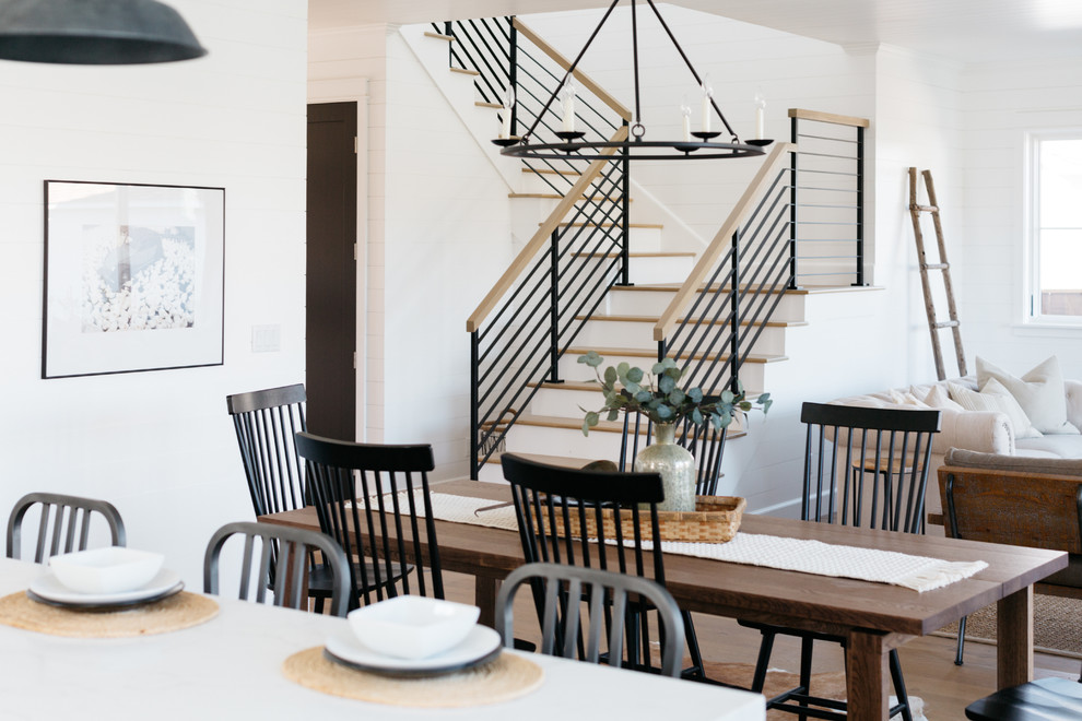 Design ideas for a country open plan dining in Los Angeles with white walls, medium hardwood floors and brown floor.