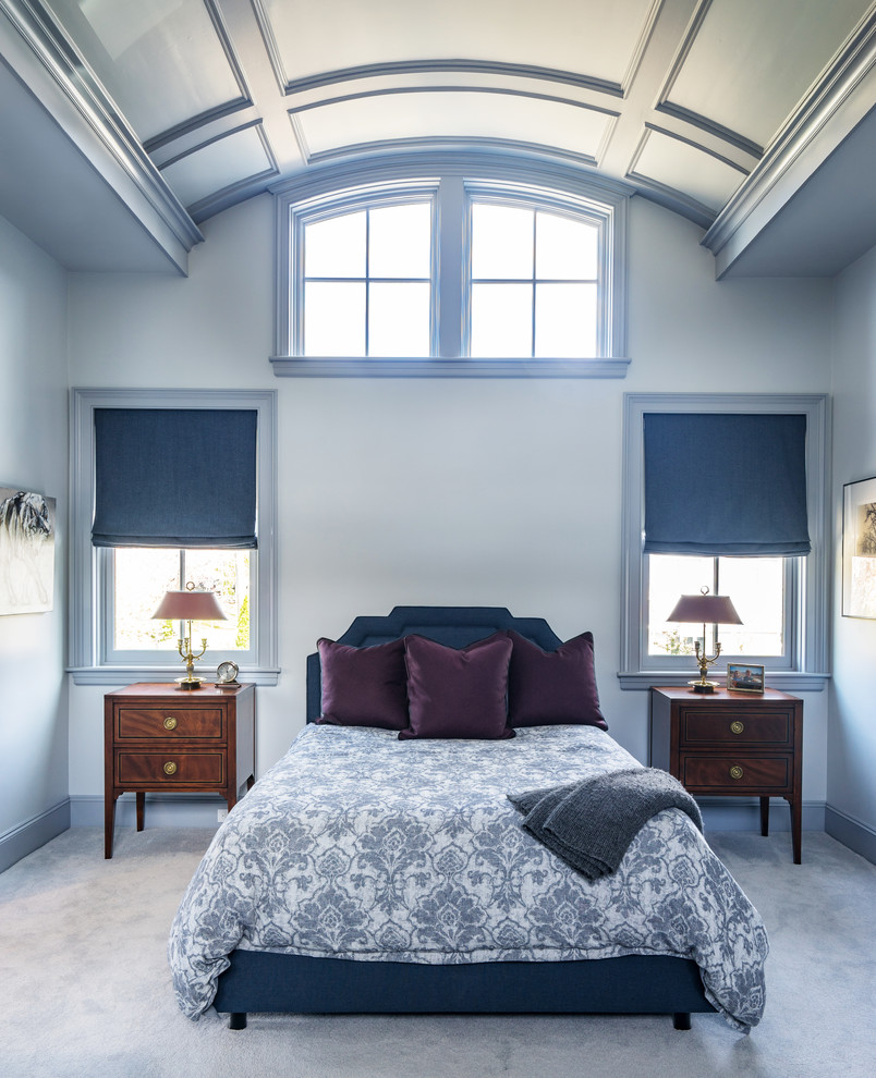 Large traditional master bedroom in Boston with blue walls, carpet and grey floor.