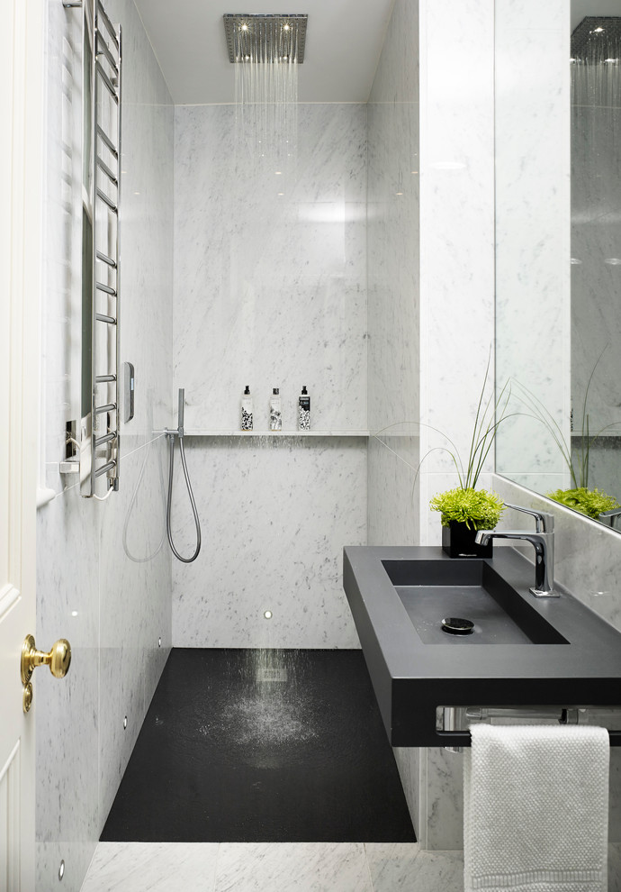 Design ideas for a contemporary bathroom in London with an integrated sink, a curbless shower, white tile, stone tile, white walls, marble floors and grey floor.