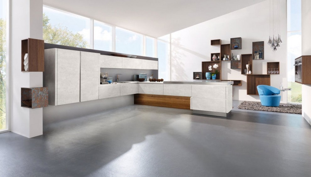 Design ideas for a mid-sized modern l-shaped open plan kitchen in New York with flat-panel cabinets, white cabinets, zinc benchtops, grey splashback, vinyl floors, no island and grey floor.