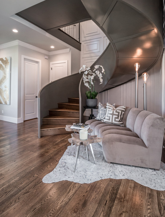 Photo of an expansive transitional foyer in Other with white walls, medium hardwood floors, a double front door, a glass front door and brown floor.