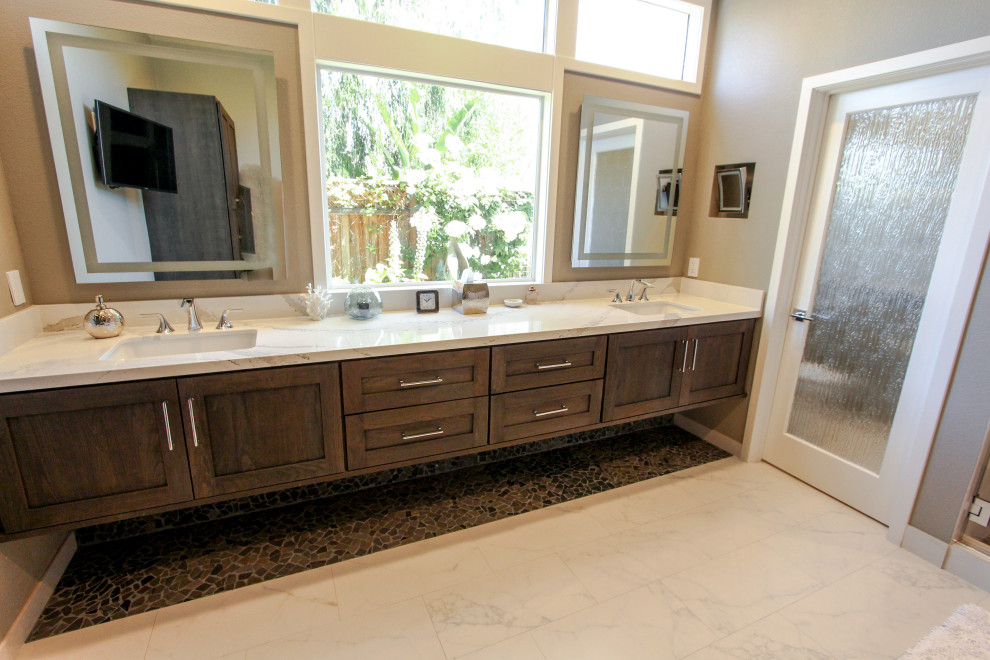 Example of a large transitional master white tile and porcelain tile porcelain tile, white floor and double-sink corner shower design in San Francisco with shaker cabinets, dark wood cabinets, a one-piece toilet, beige walls, an undermount sink, quartz countertops, a hinged shower door, white countertops, a niche and a floating vanity