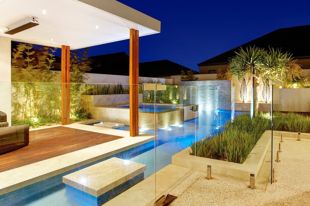 This is an example of a contemporary backyard custom-shaped pool in Perth.