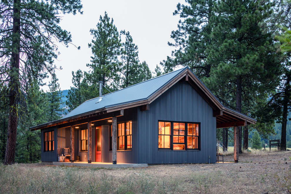 Rustic gray one-story exterior home idea in Other with a metal roof