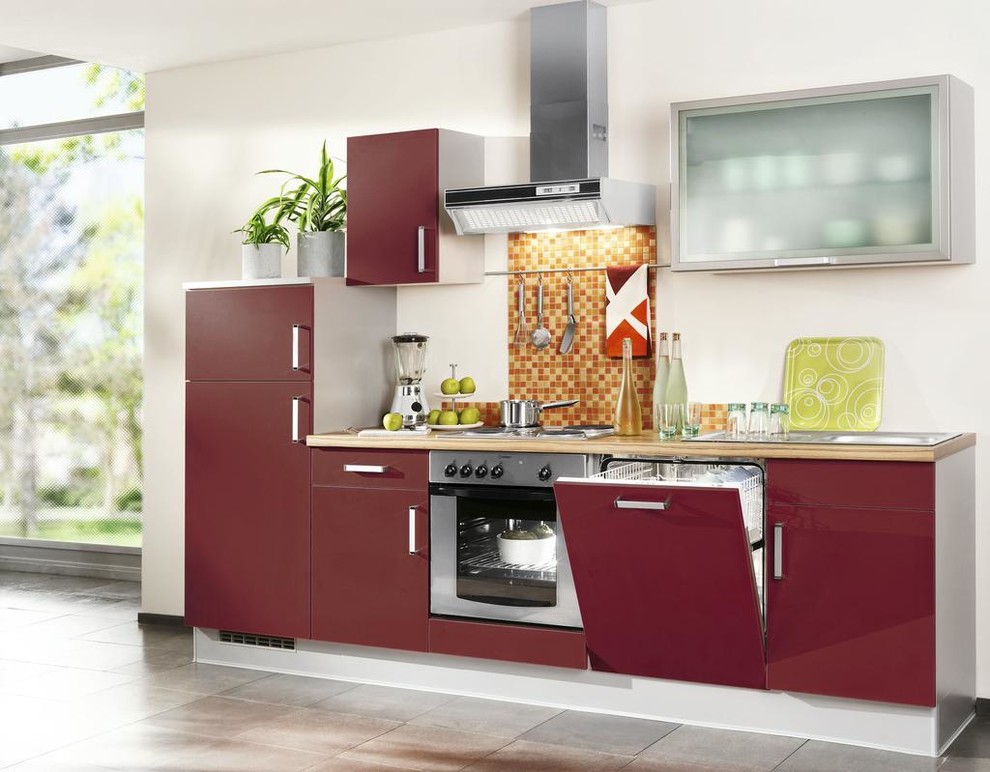 Photo of a small contemporary single-wall open plan kitchen in Other with a built-in sink, flat-panel cabinets, red cabinets, wood worktops, stainless steel appliances and no island.