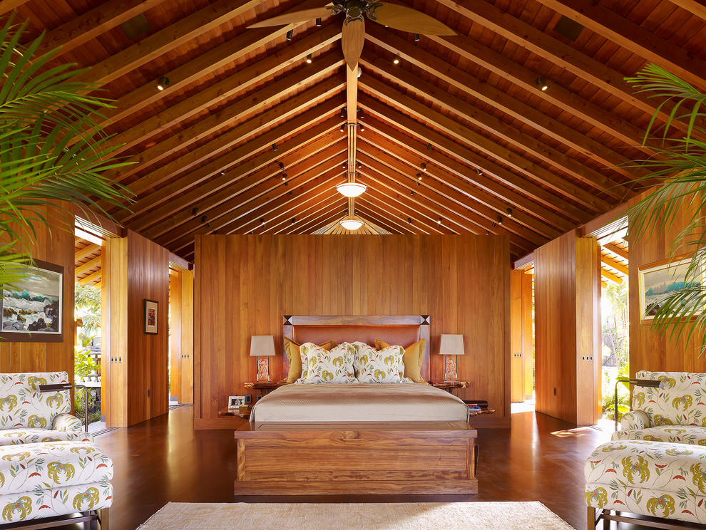 This is an example of a tropical bedroom in San Francisco with medium hardwood floors.