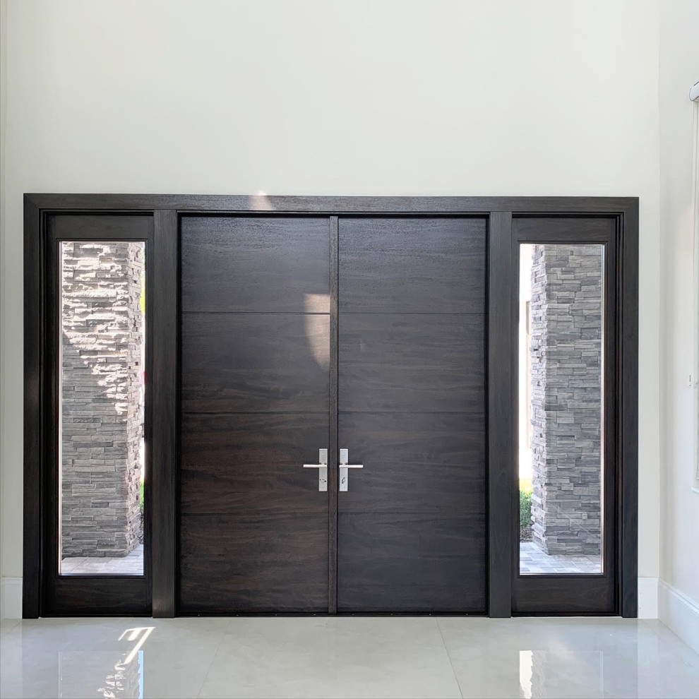 Inspiration for a modern front door in Miami with white walls, porcelain floors, a double front door, a medium wood front door and white floor.